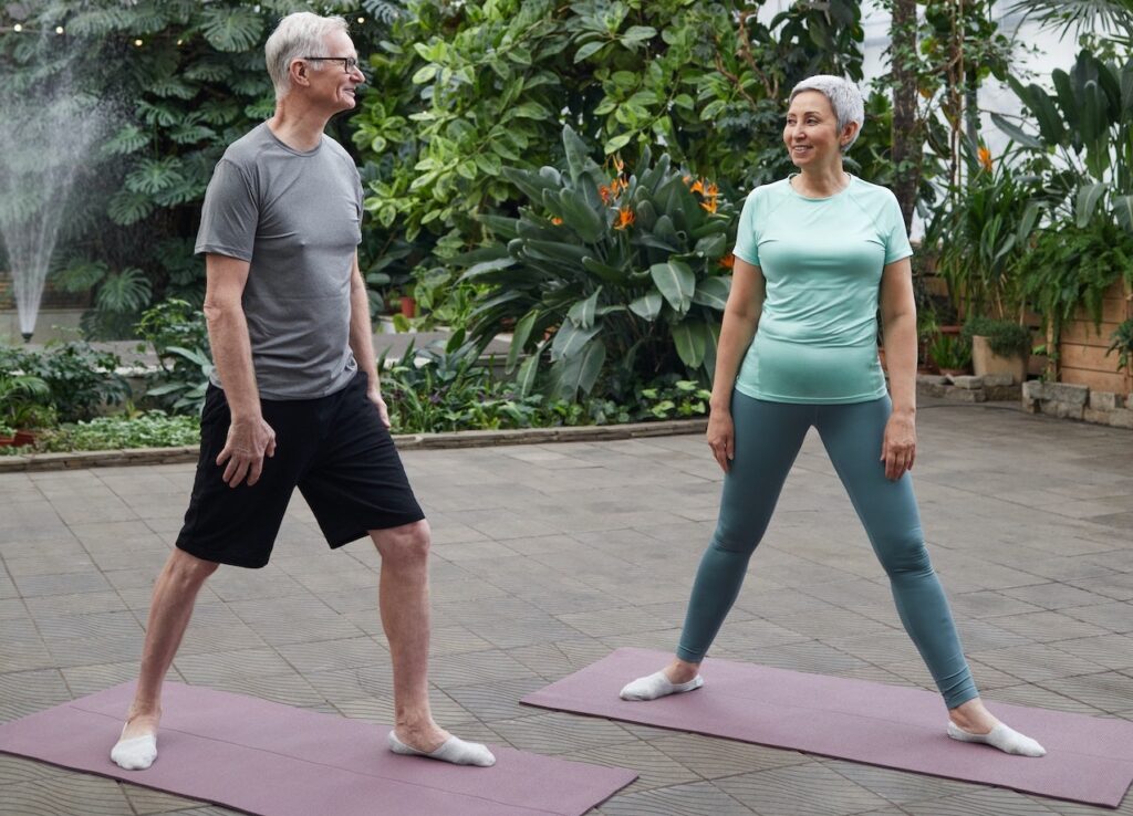 older adults practicing yoga